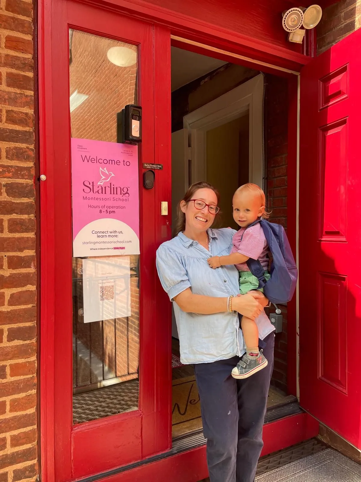 Fabienne Deaton, founder of Starling Montessori, welcoming a toddler at the school's front door on Capitol Hill